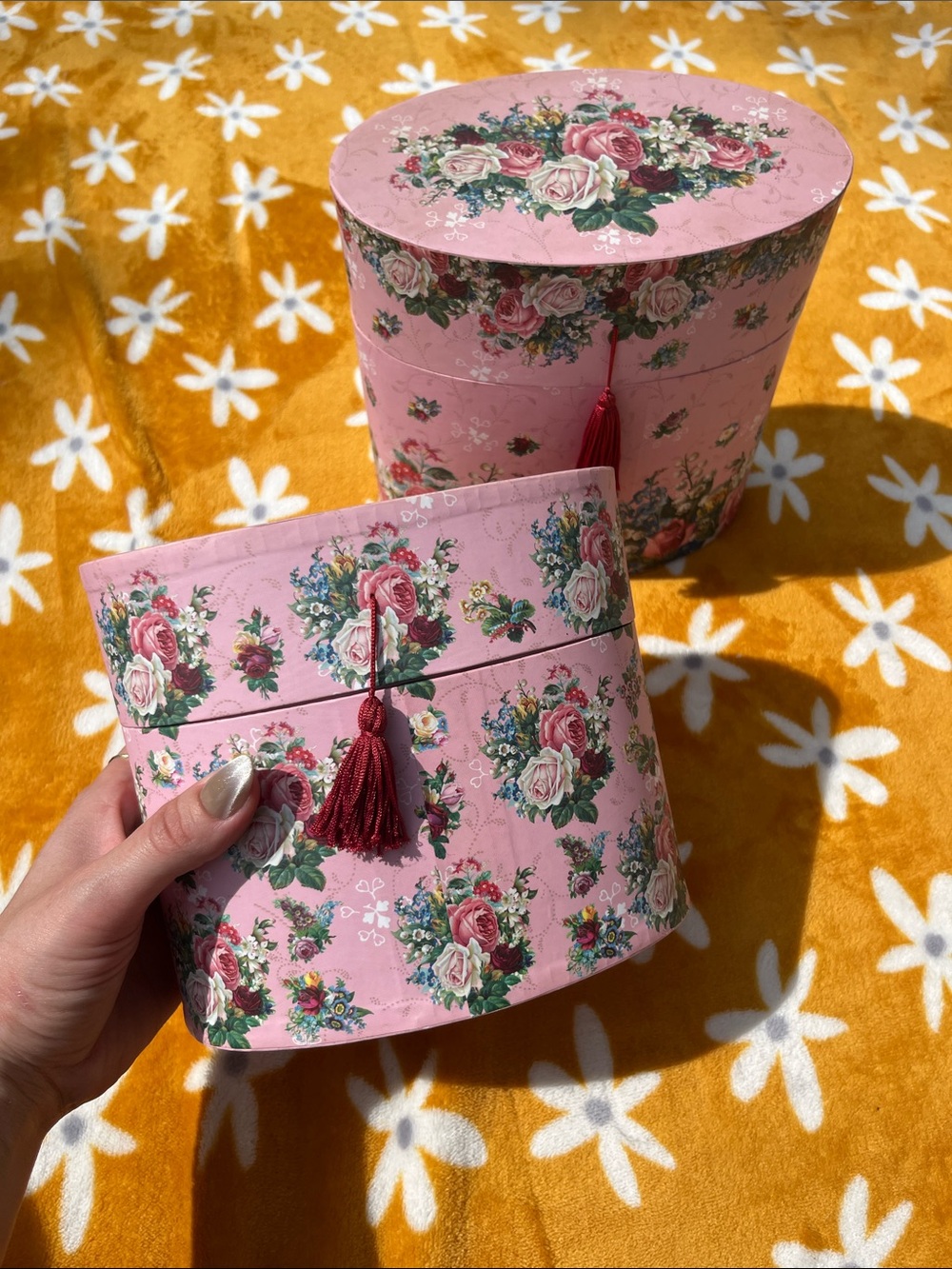 Two Vintage Pink Floral Print Oval Shaped Storage Vanity Boxes with Red Tassels
